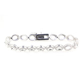 Sterling silver semi mount tennis bracelet setting with oval spaces for gemstones, featuring a stainless steel tongue clasp.